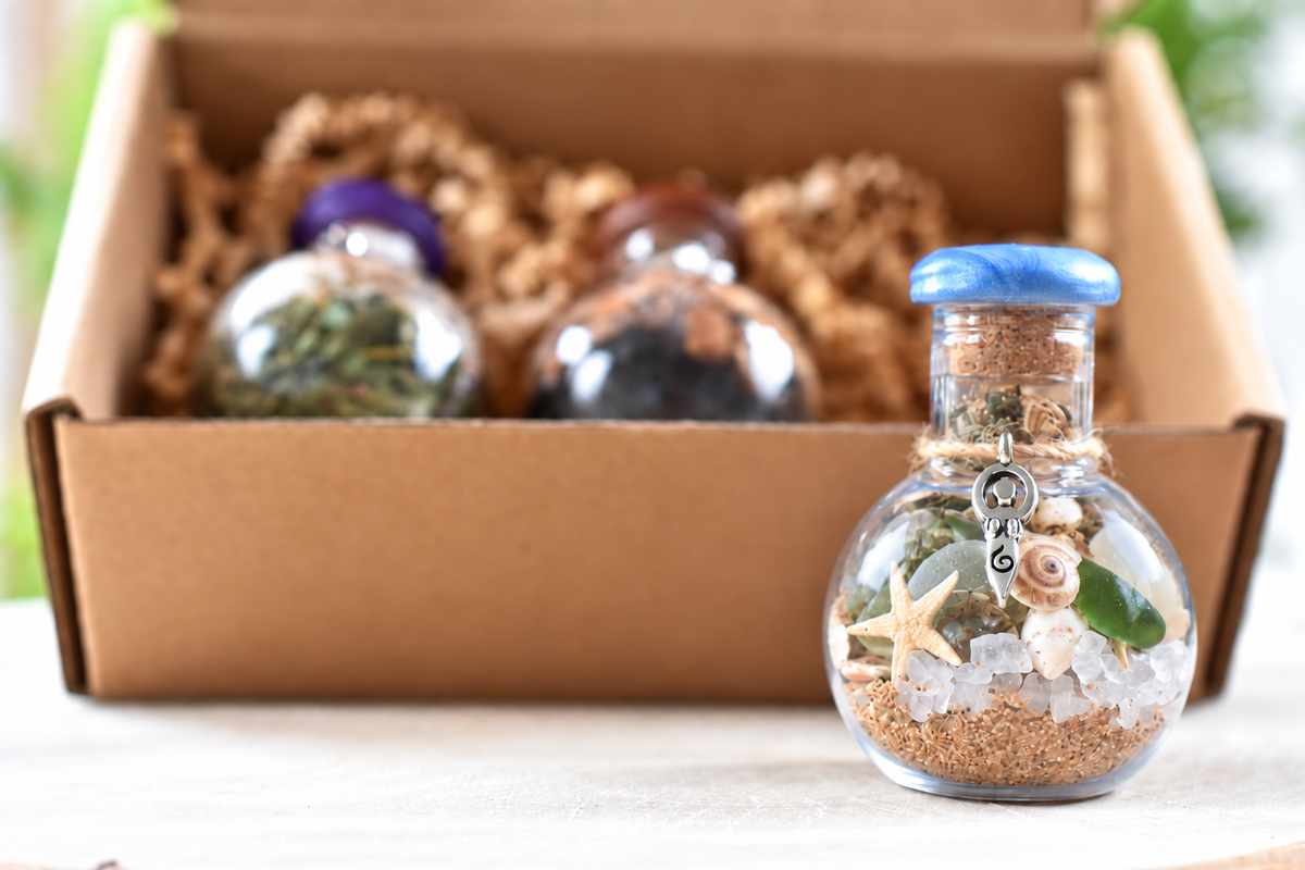 Yarrow Moon Offering Jars collection with Daughter of the Sea jar in front of the boxed trio.