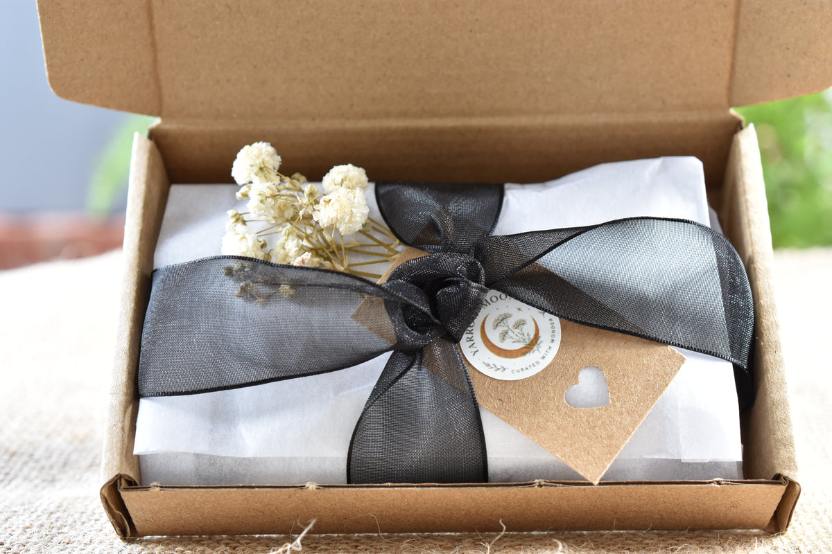 The Crow Familiar Pouch presented in Yarrow Moon kraft packaging.