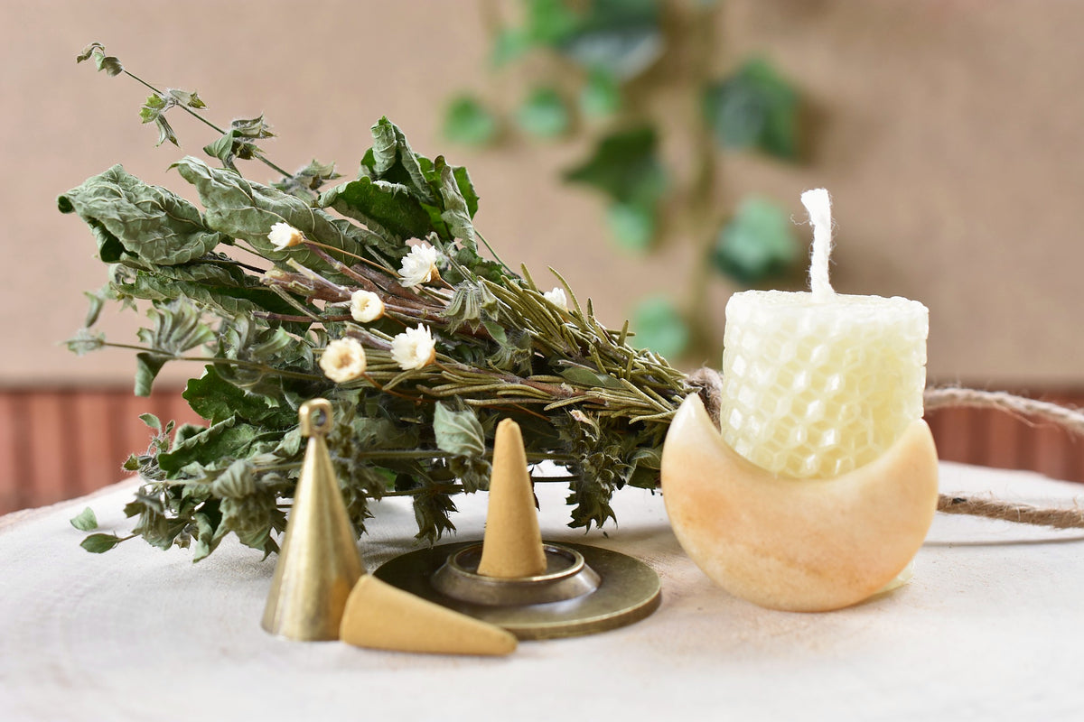 Complete Sunwater bath ritual with botanical steam bundle, candle, incense and crystal.