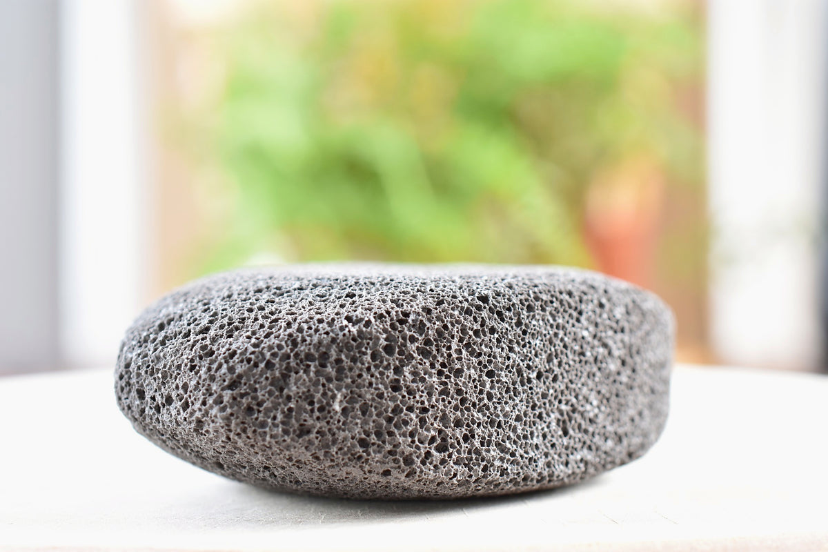 Close-up of the natural pumice stone included in the Wellspring Bath Ritual Kit.