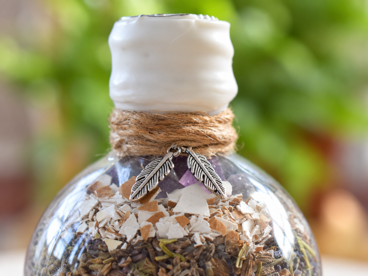 Protective Shield feather charm detail