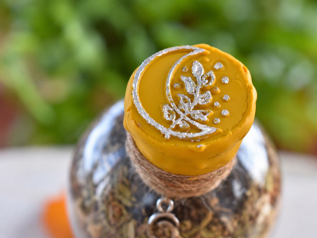 Release & Renewal yellow wax seal detail